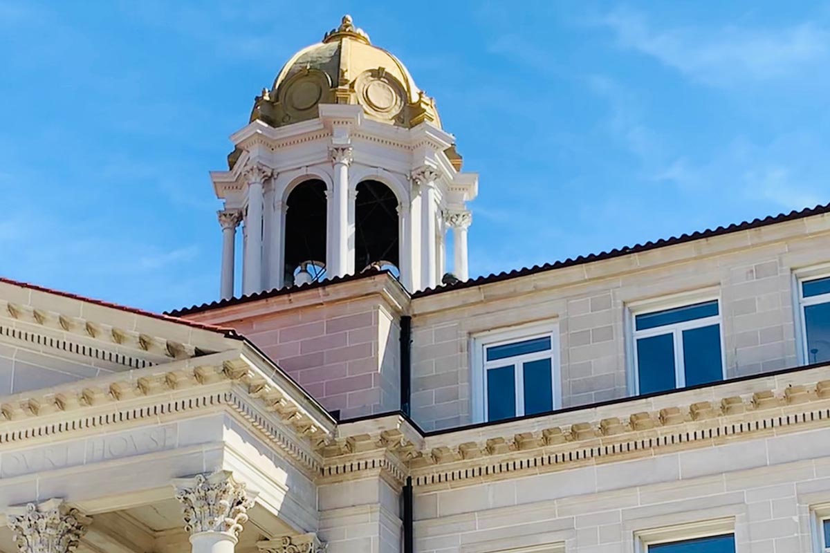 Steeple on top of a white stone building