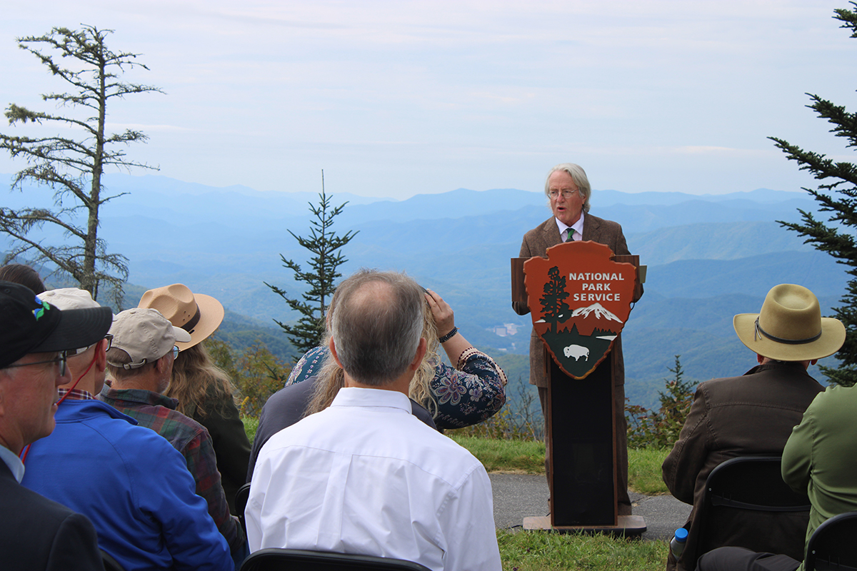 Man standing at a podium with 