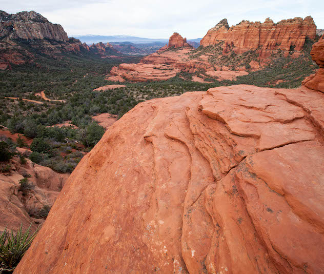 Tan rock jutting out over valley